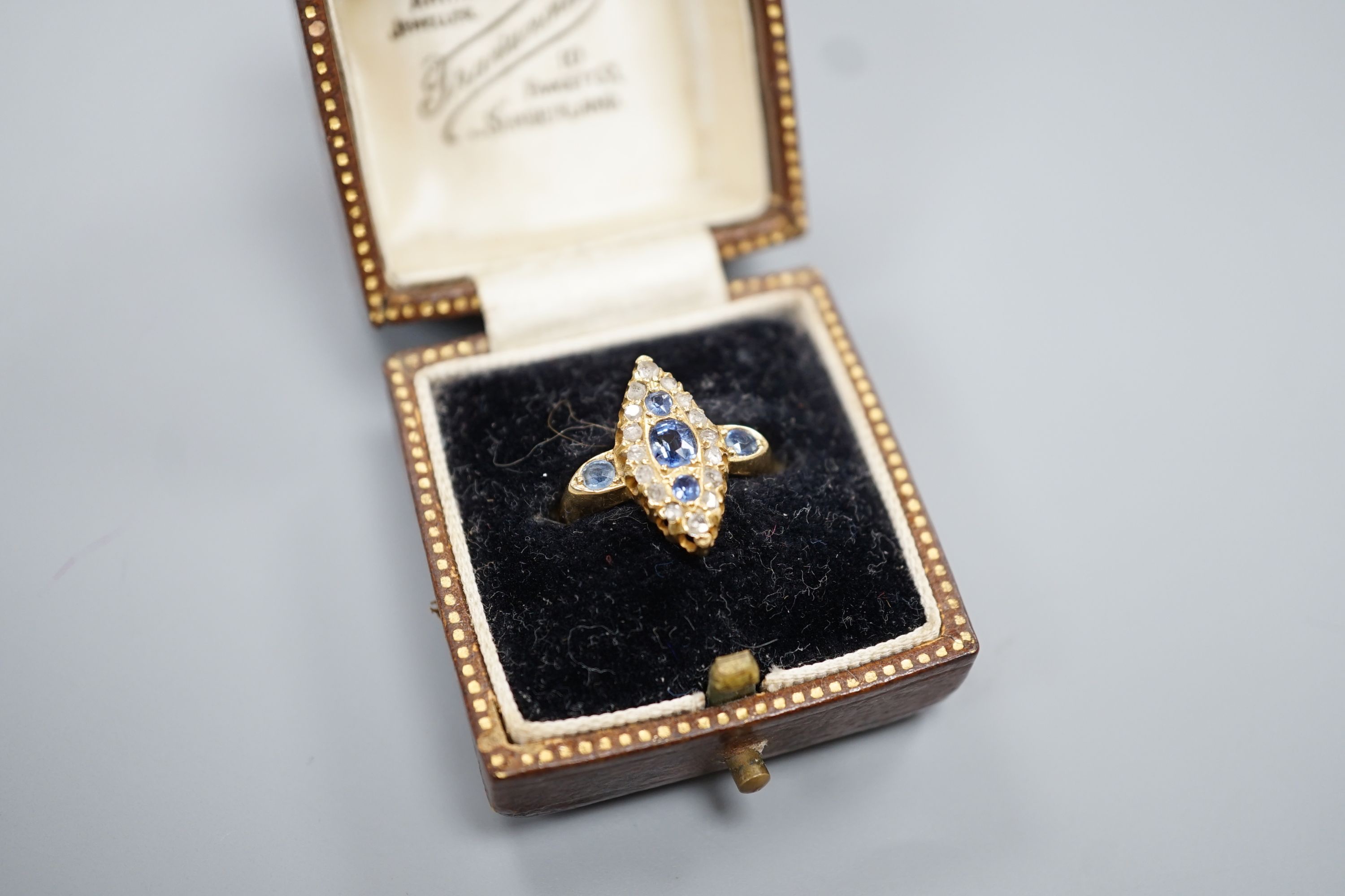 An Edwardian 18ct gold, sapphire and diamond set marquise set cluster ring, size K, gross weight 3.2 grams